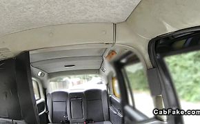 Redhead with massive tits banged in a fake taxi